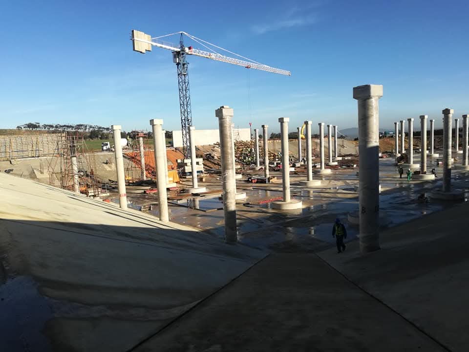 Wide-angle massive concrete structure with scaffolding
